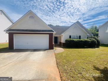 Charming home with a well-maintained lawn and attached garage, perfect for suburban living at 6190 Winston Trce, Mcdonough, GA 30252