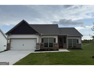 Charming one-story home with attached garage and well-manicured lawn at 378 Cantrell Dr, Dallas, GA 30157