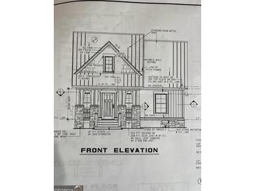 Blueprint of home showcasing a covered porch with stone columns and a standing seam metal roof at 509 Tree Rdg, Carrollton, GA 30116
