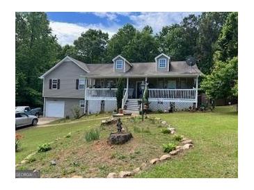 Charming house with a quaint front yard and a cozy covered porch at 1137 Eagles Nest Cir, Carrollton, GA 30116