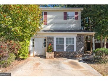 Charming two-story home featuring brick accents, neutral siding, and a well-maintained front yard at 3652 Platina Park Ct, Decatur, GA 30034