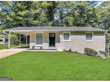 Charming single-story home with a well-manicured lawn and a welcoming black front door at 438 Fedora Nw Way, Atlanta, GA 30331