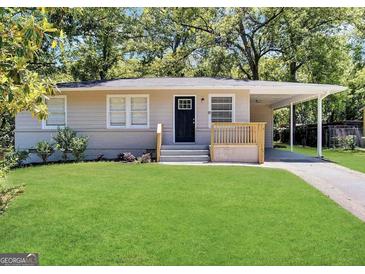 Charming single-story home with a well-manicured lawn, carport, and inviting front porch at 250 Glenrose Sw Cir, Atlanta, GA 30354