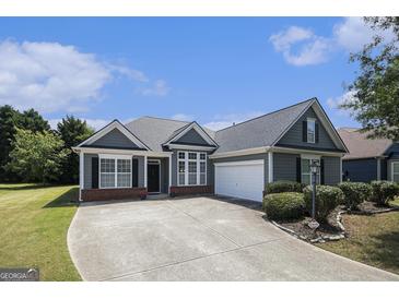 Charming one-story home featuring a two-car garage, well-maintained landscaping, and inviting curb appeal at 3634 Cape Ln, Conyers, GA 30013