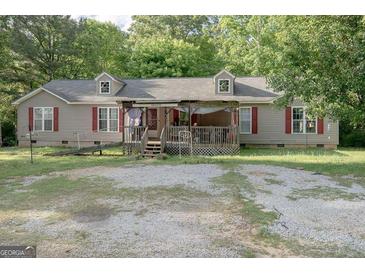 Charming single-Gathering home featuring a welcoming front porch and well-maintained exterior at 714 Yates Rd, Bowdon, GA 30108
