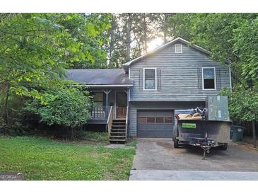 Charming two-story home with attached garage and partially wooded lot at 4060 Sumit Wood Nw Dr, Kennesaw, GA 30152