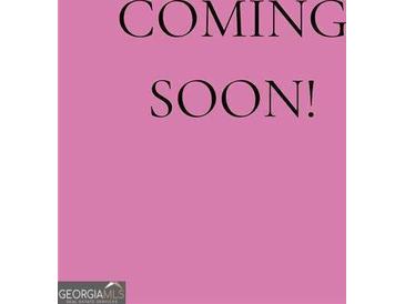 Real estate listing with text 'Coming Soon' on a pink background, indicating the property will be available soon at 1928 Stancrest Nw Trce, Kennesaw, GA 30152