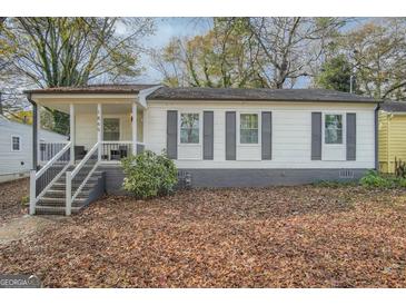 Charming single-story home with a welcoming front porch and gray shutters at 1865 Broadwell Sw St, Atlanta, GA 30310