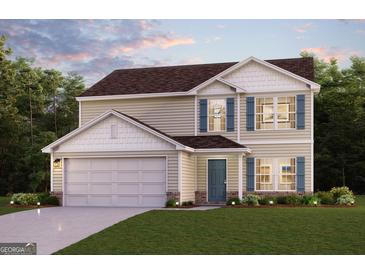 Charming two-story home with a two-car garage, manicured lawn, and decorative shutters at 4670 Sunrise Rdg, Covington, GA 30016