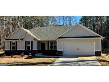 Charming single-story home with gray siding, black shutters, and a well-manicured front yard at 344 Dylan Way, Mcdonough, GA 30252