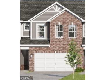 Charming two-story townhome showcasing brick and gray siding, complemented by an attached two-car garage at 2036 Piccolo Ct # 225, Mcdonough, GA 30252
