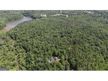Secluded home site surrounded by lush, mature trees offers privacy and tranquility at 5780 Pumkintown Rd, Douglasville, GA 30135