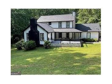 Charming two-story home with black trim and a spacious front yard at 172 Oak Forest Se Dr, Smyrna, GA 30082
