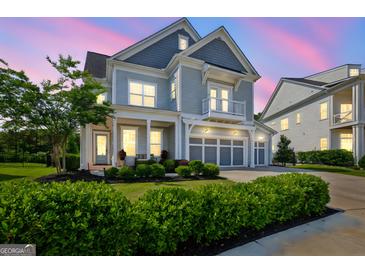 Stunning two-story home featuring a three-car garage and a charming second-story balcony at 229 Widener Way, Peachtree City, GA 30269
