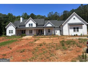 Charming new construction home with a white exterior and a covered front porch at 1333 Happy Hill Rd, Carrollton, GA 30116