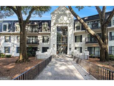 Charming condo building with striking architecture and mature trees at 2119 Pine Heights Ne Dr, Atlanta, GA 30324