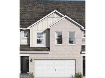Charming brick home with a two-car garage and a classic architectural design at 2276 Santa Fe St # 19, Morrow, GA 30260