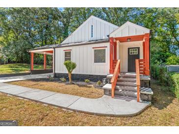 Charming craftsman home with inviting front porch and steps leading to the black front door at 317 Mcpherson Se Pl, Atlanta, GA 30316
