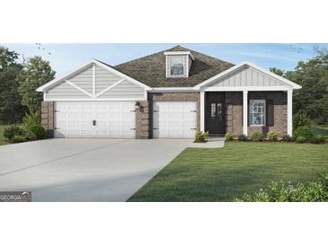 Charming brick home featuring a two-car garage and well-manicured lawn at 1217 Trombone Way # 6, Mcdonough, GA 30252