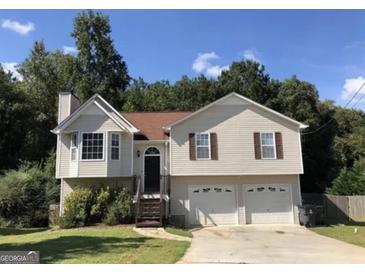 Charming two-story home featuring a two-car garage, a well-maintained yard, and a classic design at 639 Sheffield Ct, Villa Rica, GA 30180