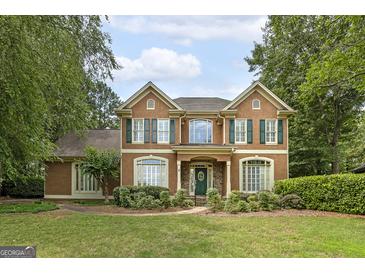 Charming two-story home with green shutters and a well-manicured lawn at 170 Glen Eagle Way, Mcdonough, GA 30253