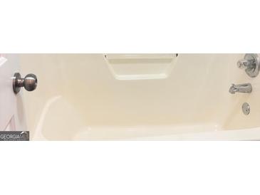 Full bathtub featuring a chrome faucet and shower head at 4411 Ward Bluff Ct, Ellenwood, GA 30294