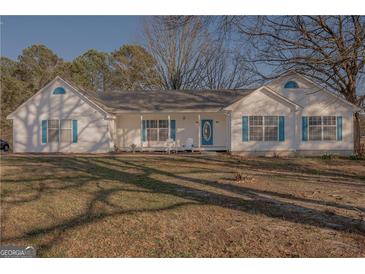 Charming single-story home with a quaint front porch and well-maintained landscaping at 726 Mcdaniel Mill Sw Rd, Conyers, GA 30094