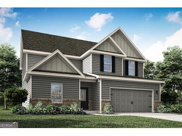 Two-story home featuring gray siding, brick accents, complemented by landscaped yard and a two-car garage at 412 Cantrell Drive, Dallas, GA 30157