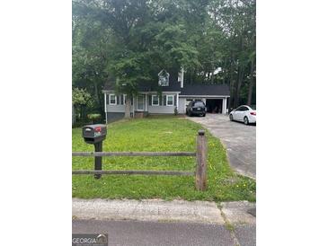 Charming two-story home with a well-maintained lawn and mailbox at 4514 Tifton Ct, Powder Springs, GA 30127