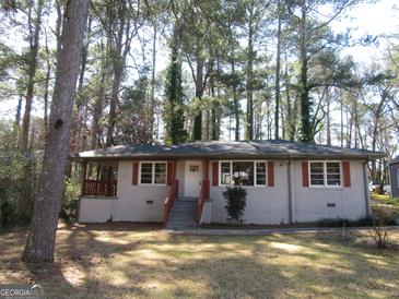 Charming single-story home with a welcoming front porch and classic architectural details at 1876 Sw Sandtown Sw Rd, Atlanta, GA 30311