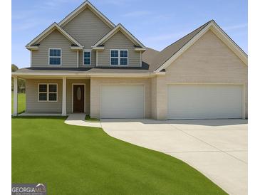Charming two-story home with a well-manicured lawn and a spacious three-car garage at 2873 Shoals Hill Ct, Dacula, GA 30019