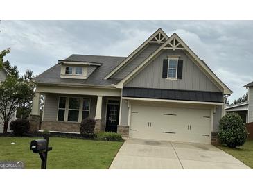 Charming craftsman-style home with a two-car garage and well-maintained landscaping at 471 Lanier Ct, Hiram, GA 30141