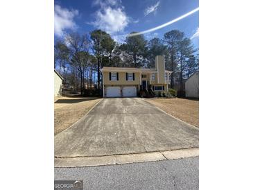 Inviting two-story home with a two-car garage and a spacious driveway at 6205 Littleton Dr, Union City, GA 30291