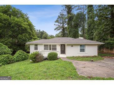 Charming one-story home featuring a freshly painted exterior and a welcoming front porch at 1854 Shadydale Se Ave, Atlanta, GA 30315