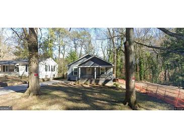 Charming single-Gathering home with a welcoming front porch and a well-maintained yard at 1063 Nw Cato Nw St, Atlanta, GA 30318