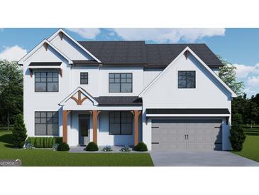 Charming two-story home featuring a white brick exterior, black framed windows, and a gray garage door at 315 Westfall Ter # 226A, Loganville, GA 30052