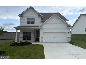 Charming two-story home with a two-car garage and a well-manicured front yard at 368 Cantrell Drive, Dallas, GA 30157