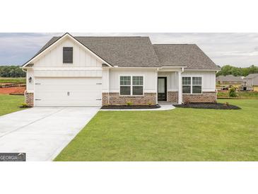 Beautiful single Gathering home with a 2 car garage and manicured lawn at 280 Oliver Dr, Locust Grove, GA 30248