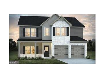 Charming two-story home with a symmetrical facade, attached two-car garage, and a well-maintained front yard at 91 Jacoby Dr # 103, Fairburn, GA 30213