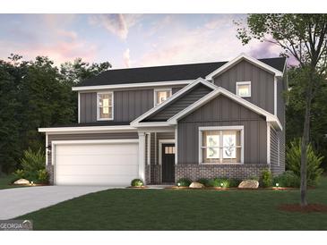 Two-story home featuring gray siding, a brick foundation, a covered front porch, an attached garage, and manicured landscaping at 2038 Brookhill Way # 6, Snellville, GA 30078