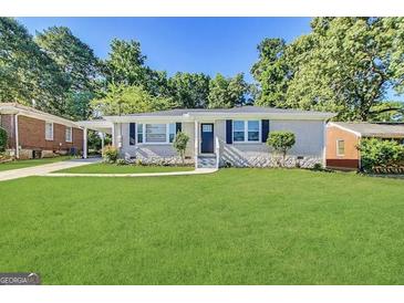 Charming single-story home with a well-manicured front yard and inviting curb appeal at 2015 Boulderview Se Dr, Atlanta, GA 30316
