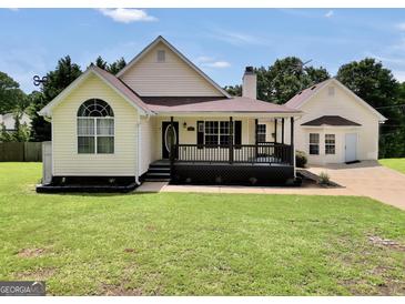 Charming single-story home with well-manicured lawn, covered porch, and welcoming curb appeal at 250 Stallsworth Rd, Mcdonough, GA 30252