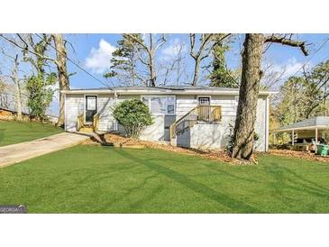 Charming one-story home with a well-manicured front lawn and inviting entryway at 2500 Brentwood Rd, Decatur, GA 30032