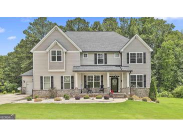 Charming two-story home with a welcoming front porch and manicured lawn at 110 Sunflower St, Tyrone, GA 30290
