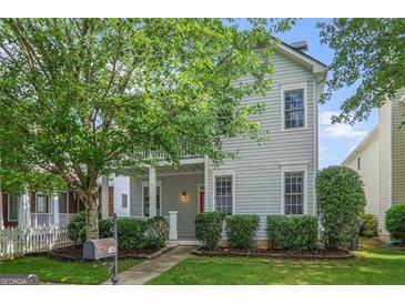 Charming two-story home with well-maintained landscaping and a welcoming front porch, perfect for enjoying the outdoors at 747 Gardenside Cir, Marietta, GA 30067