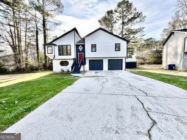 Charming two-story home with two-car garage and nicely manicured lawn at 295 Lamden Ct, Lawrenceville, GA 30046