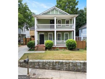 Charming two-story home with a welcoming front porch, perfect for relaxing and enjoying the neighborhood views at 187 Vanira Se Ave, Atlanta, GA 30315