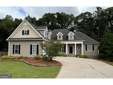 Charming home with manicured lawn, inviting entrance, and beautiful landscaping, offering great curb appeal at 237 Shockley Way, Dallas, GA 30157