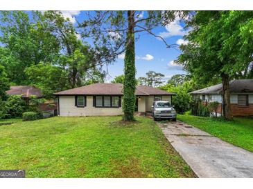 Charming, renovated single-story home with a well-maintained front yard and inviting curb appeal at 2835 Laguna Dr, Decatur, GA 30032