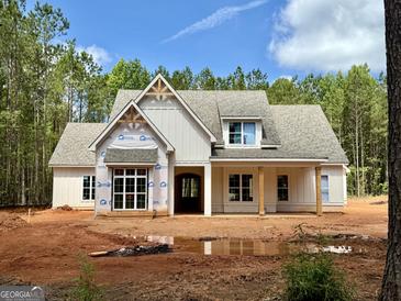 Inviting exterior view of a charming new construction home with a spacious front yard and a welcoming porch at 4 Bob Smith Rd, Sharpsburg, GA 30277